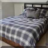 F39. Queen bed with wood headboard. 49”h 